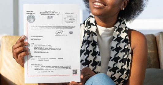 A smiling woman holding her official lunar property deed from The Moon Realtor.